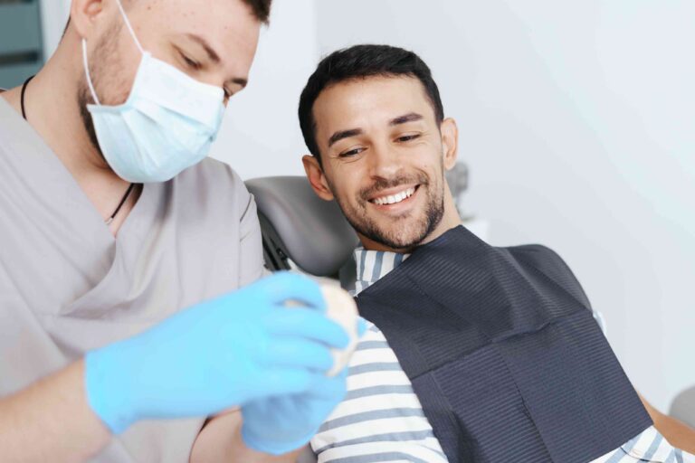 Smiling patient with dentist during a dental visit.