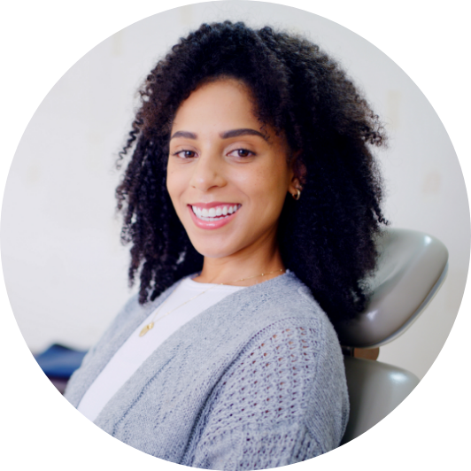 Smiling woman in a dental chair.